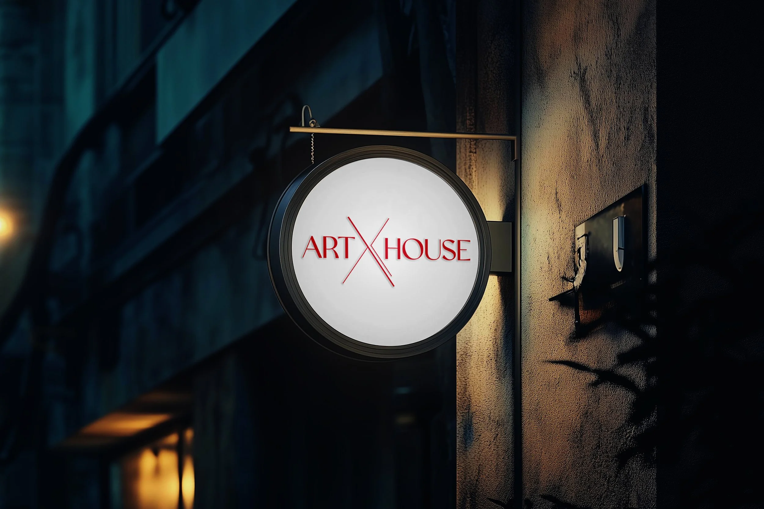 Round illuminated sign displaying red text 'ART HOUSE' with a red intersecting line symbol on a wall, creating a modern aesthetic.