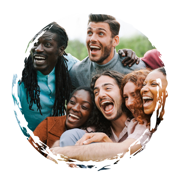Group of six people smiling and laughing together outdoors.