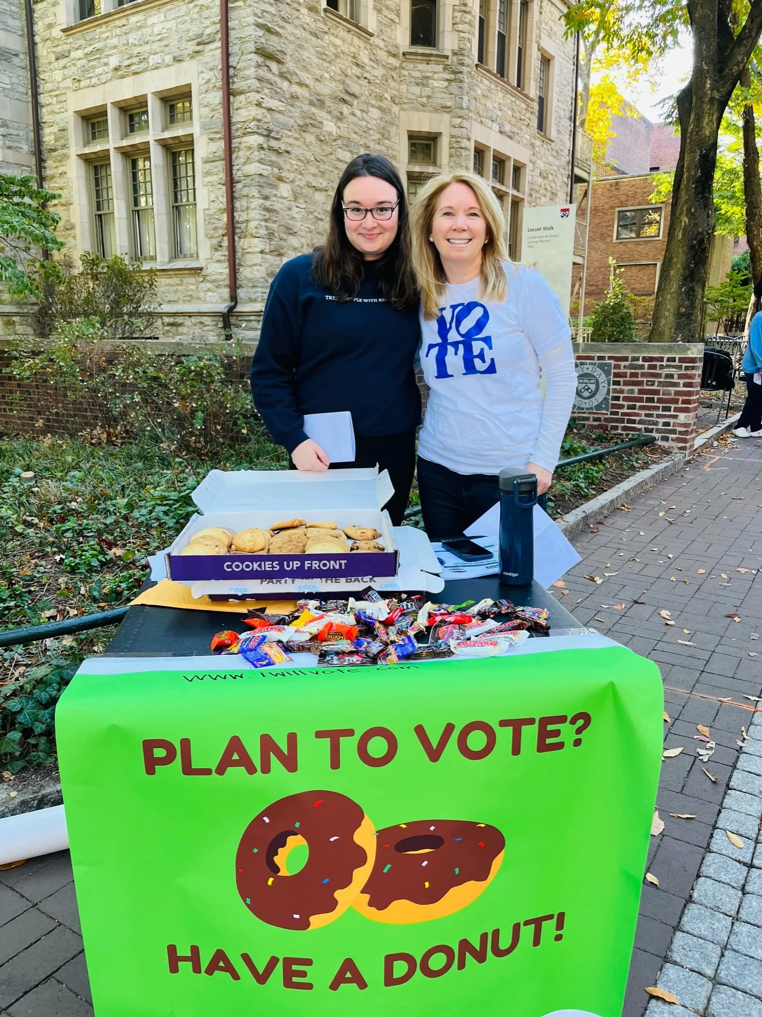 Founders behind a voter registration table at University of PA