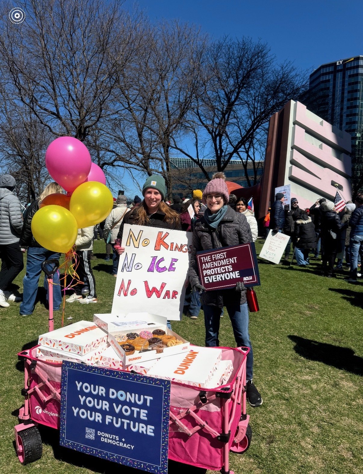 Two people with a donut wagon