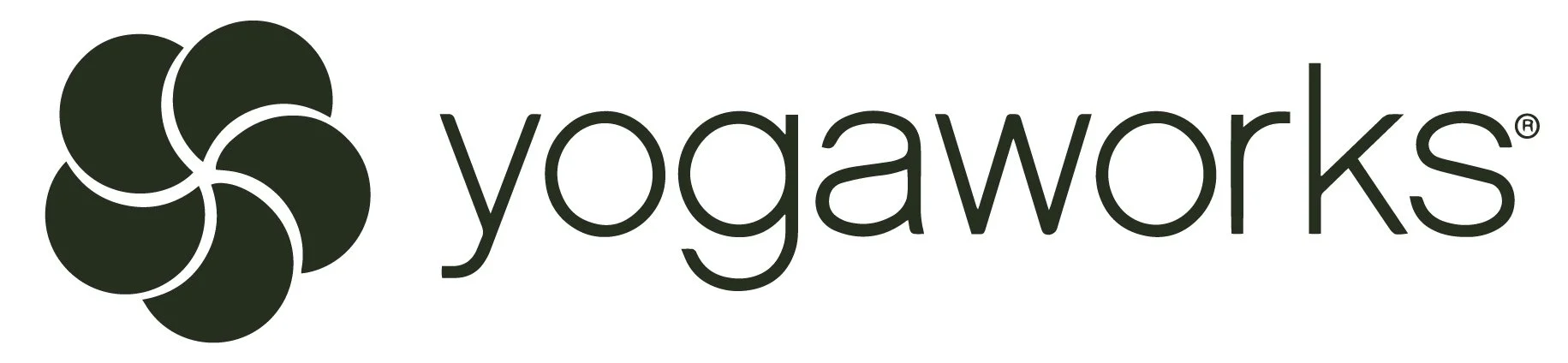 Yogaworks logo with a circular green design and the word 'yogaworks' in lowercase black letters.