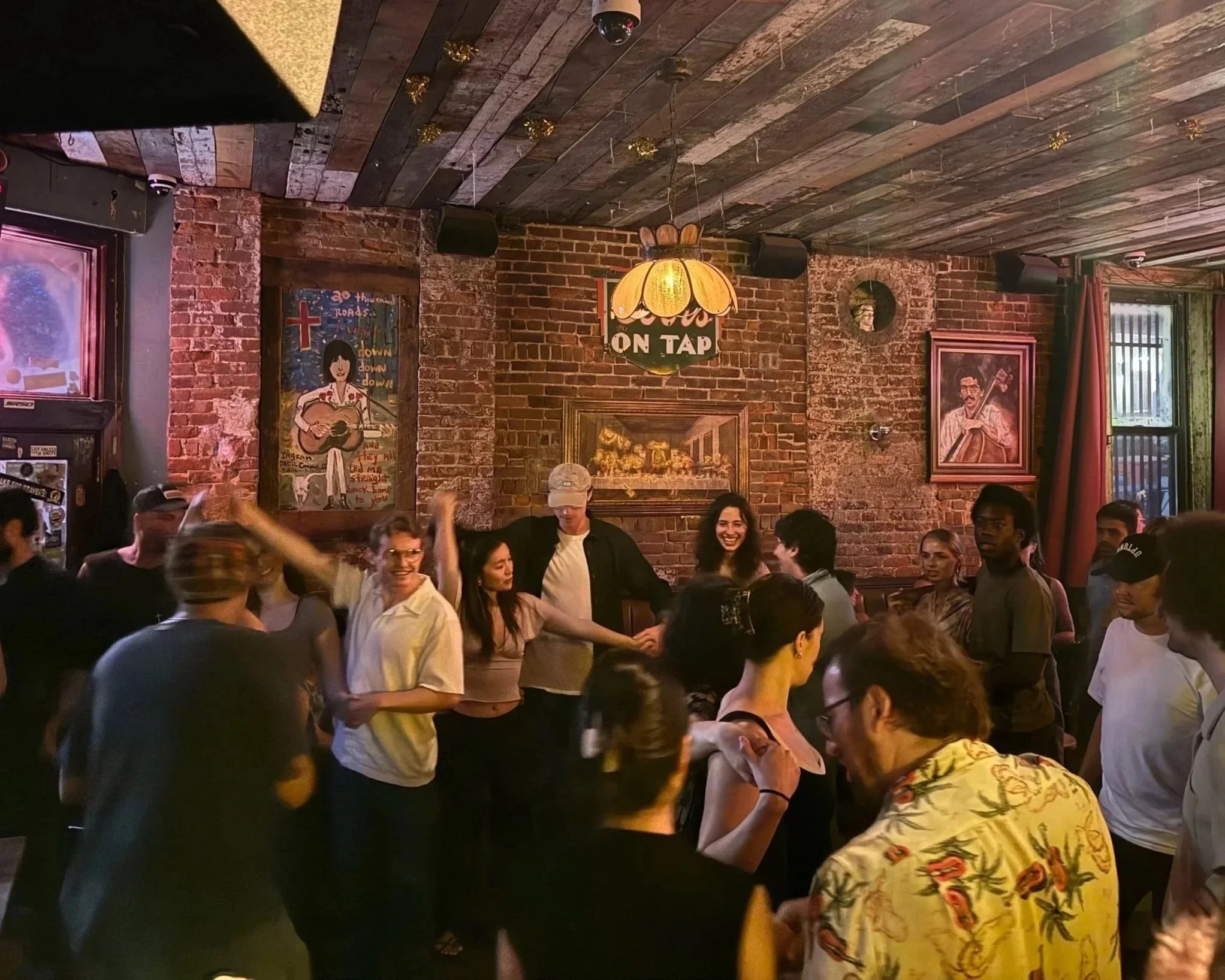 Skinny Dennis - a Texas themed Dive Bar with Live Bands every night. Gathering of diverse people for music, dance, and beers with exposed brick walls, wooden ceiling, country themed artwork & nostalgic beer signs.