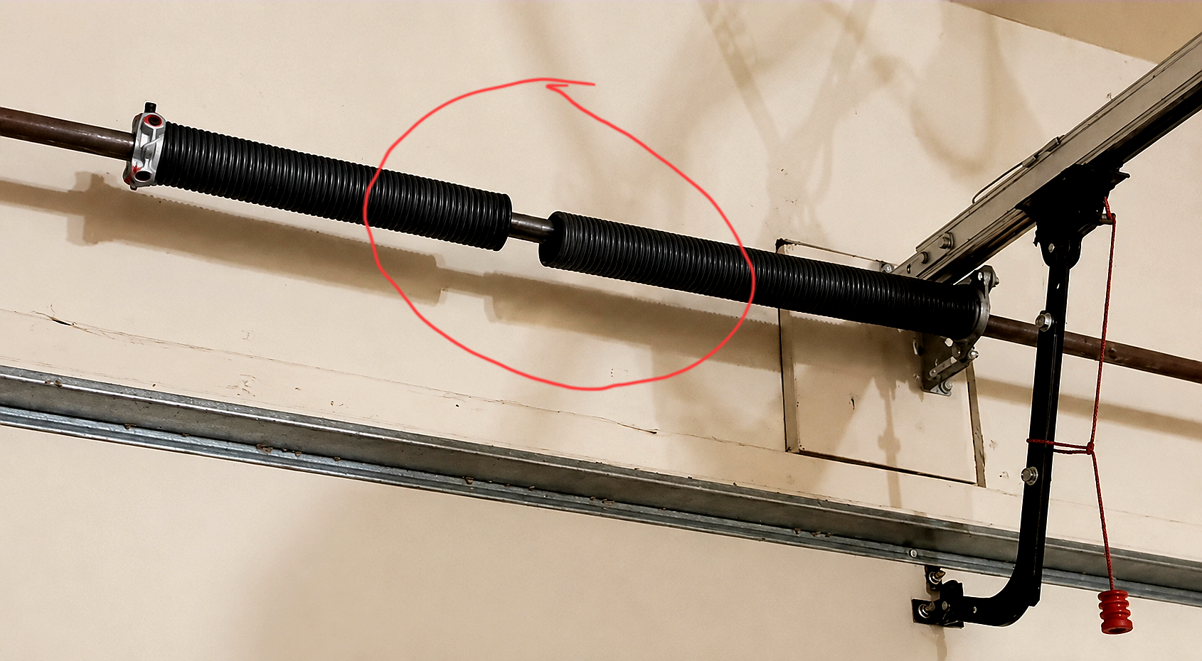 Broken torsion spring on residential garage door