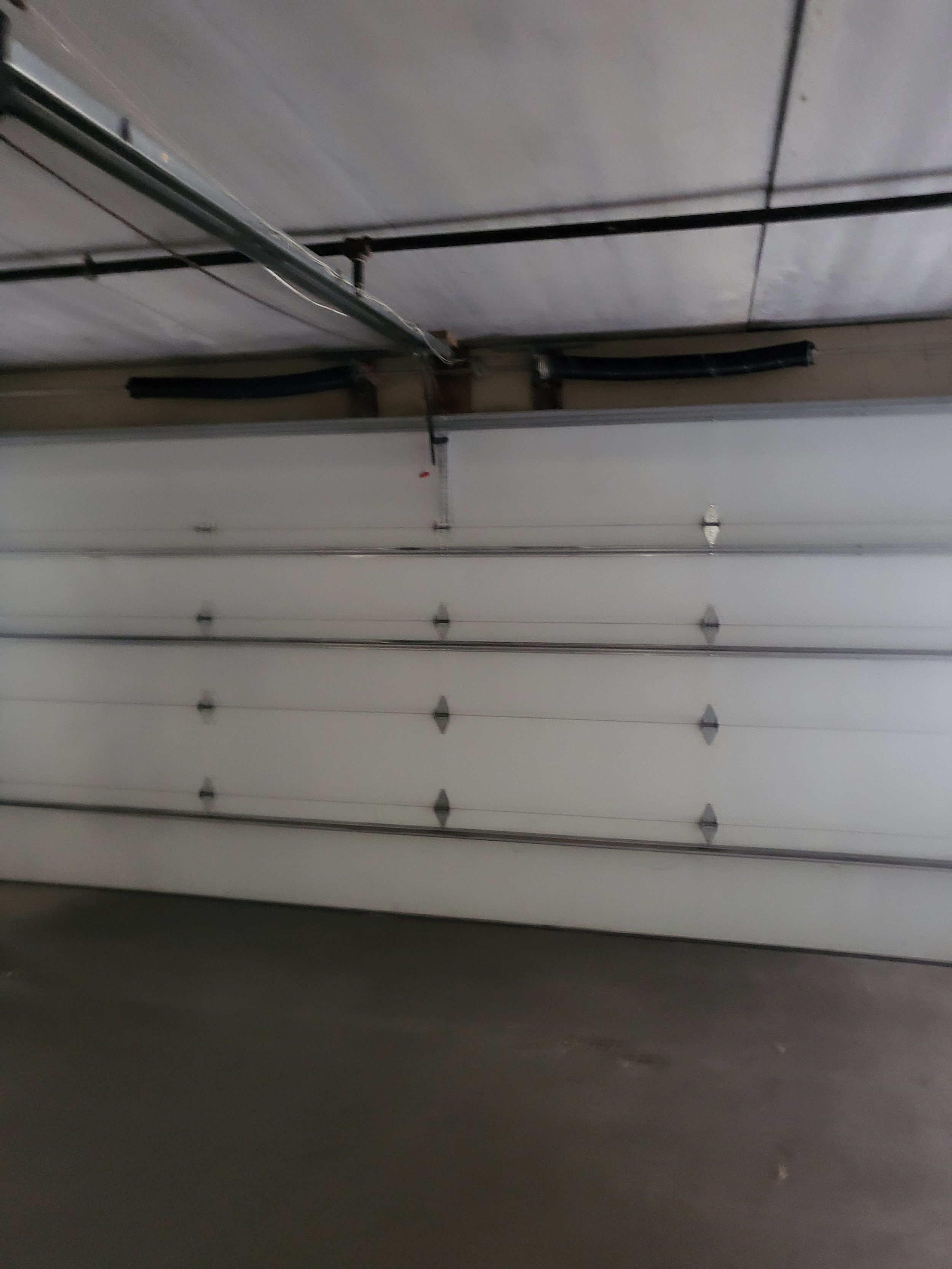 Newly repaired garage door on a Kansas City home.