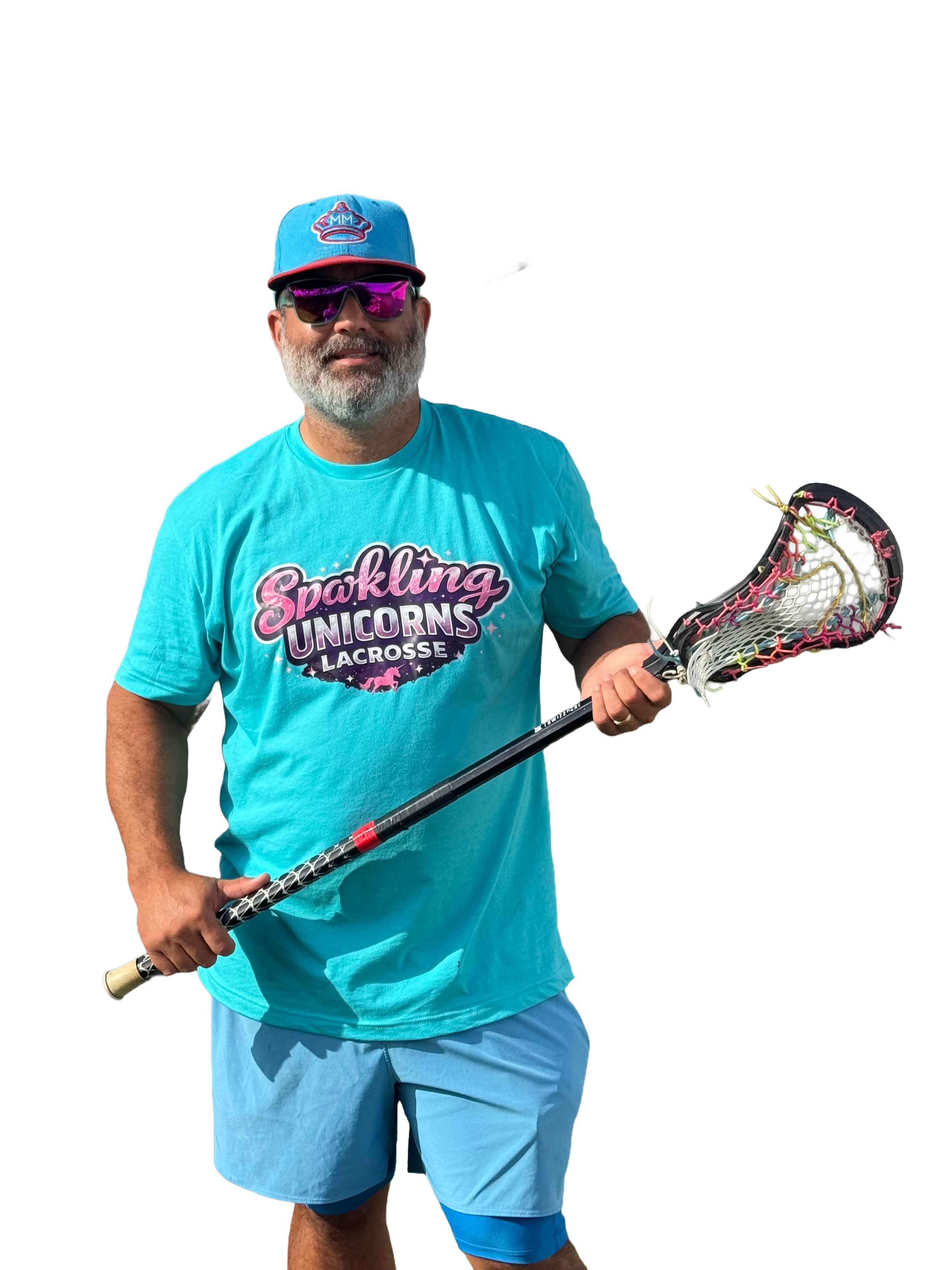 A man wearing sunglasses, a blue cap with a logo, a bright blue T-shirt with 'Sparkling Unicorns Lacrosse' written on it, and holding a lacrosse stick.