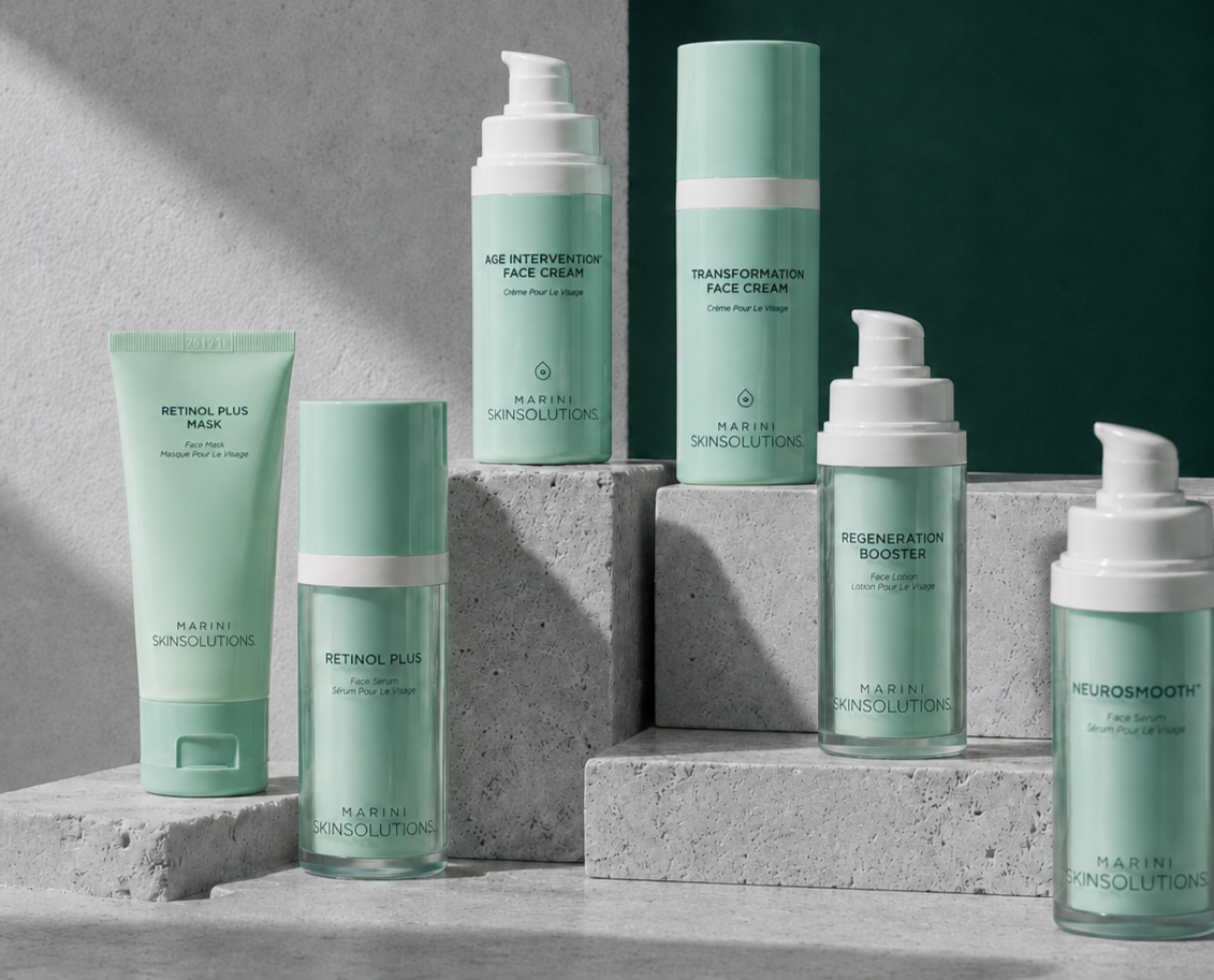 Collection of skincare products including face masks, serums, and face creams on concrete surfaces with shadows and a dark green background.