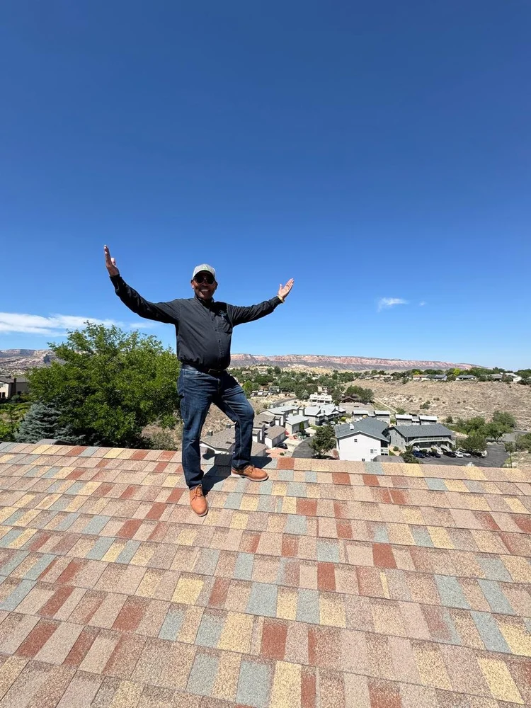Elevaro crew member celebrating on a finished roof