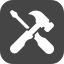 Tools such as a screwdriver and wrench crossed over each other.