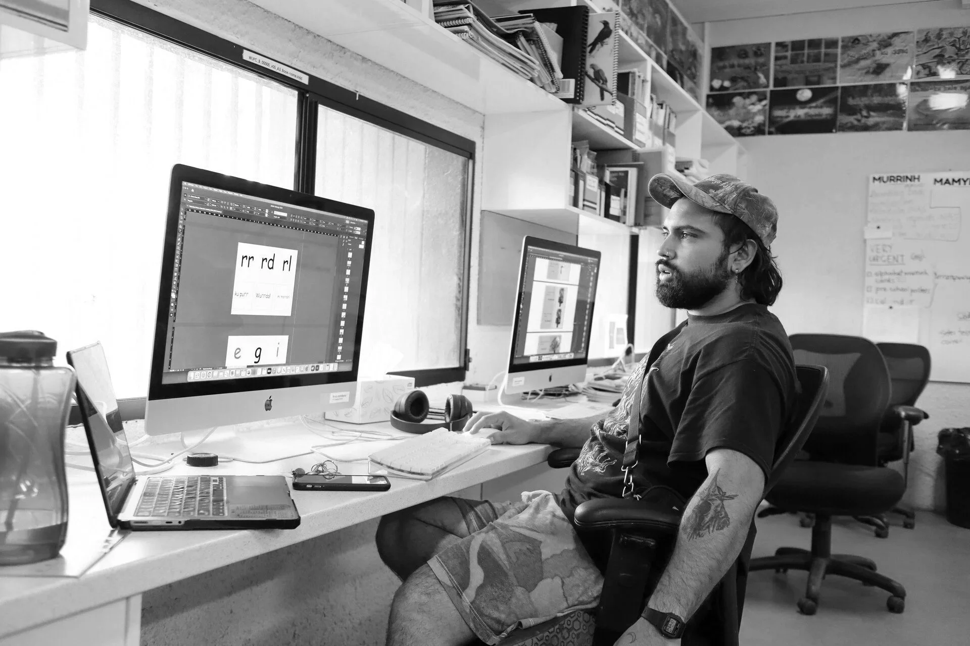 Birrugan Dunn-Velasco sits at computer desk.