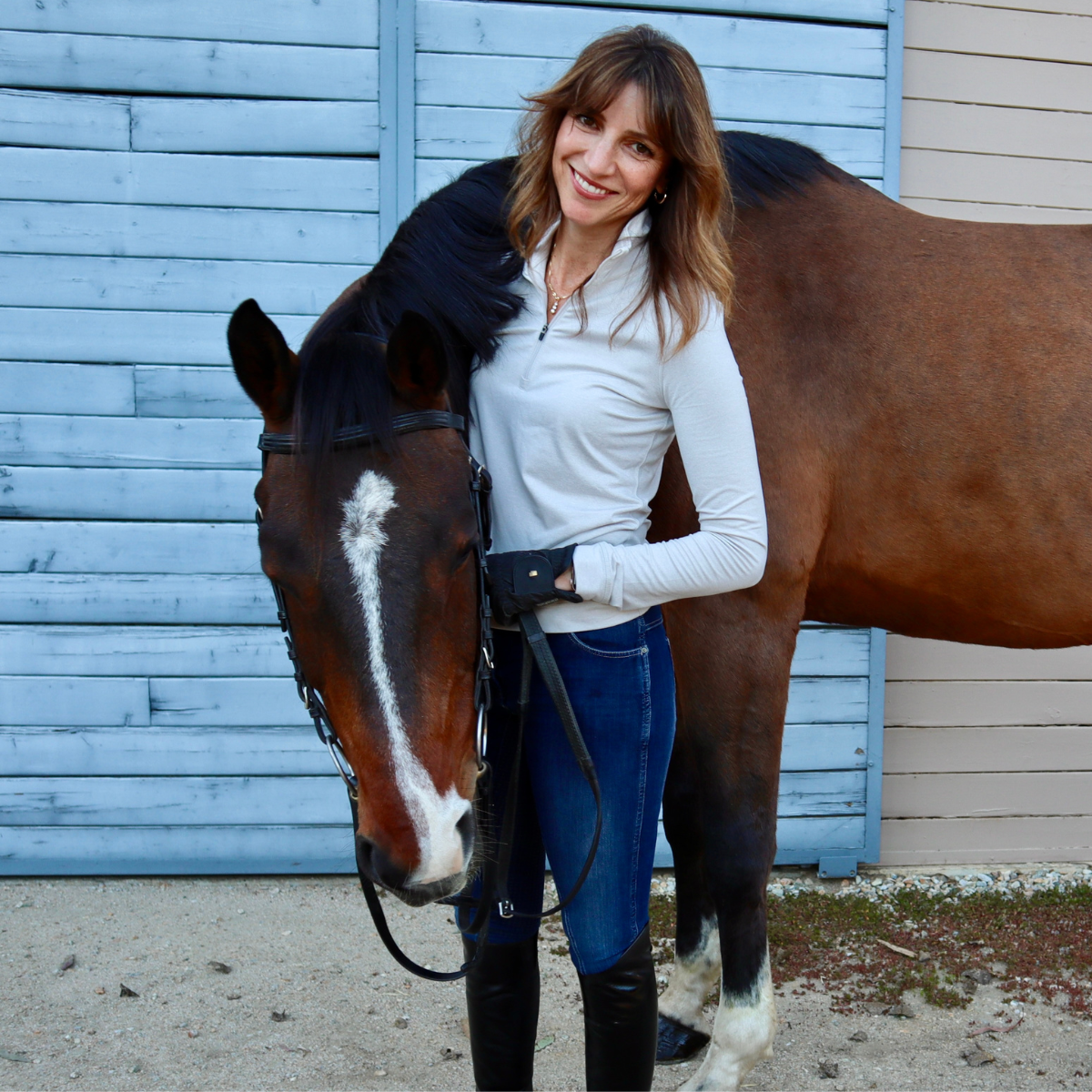 Sally Morrison, academic coach and educational specialist, standing with a horse
