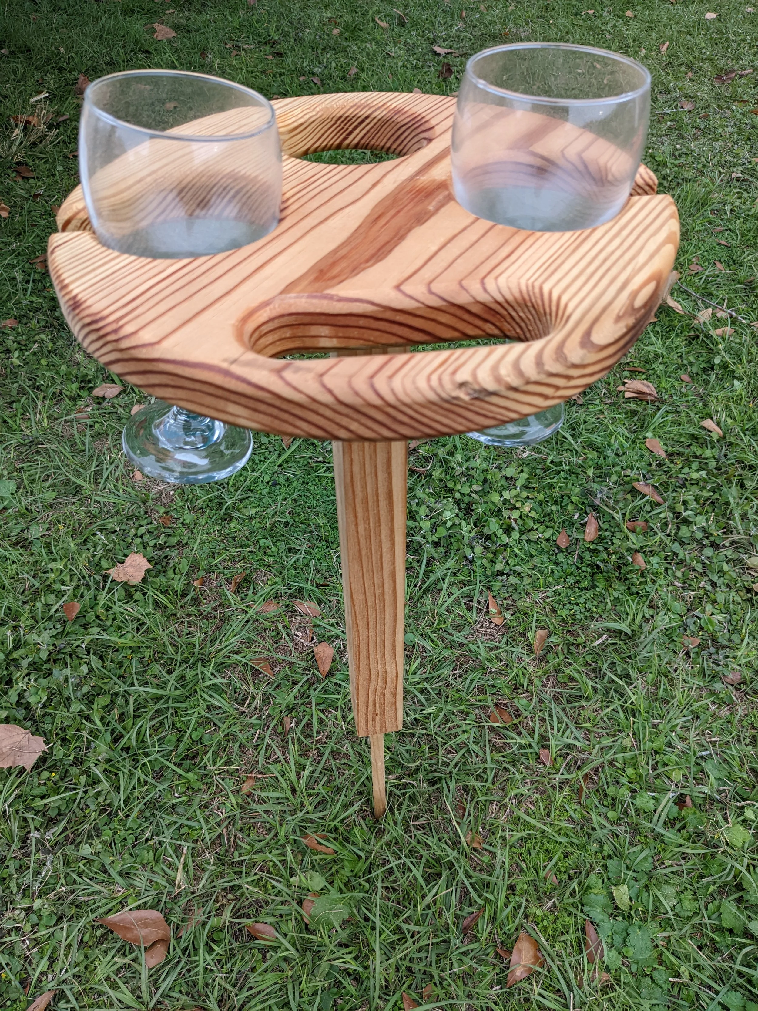 Wooden folding wine table with storage for 2 wine glasses and a bottle of wine