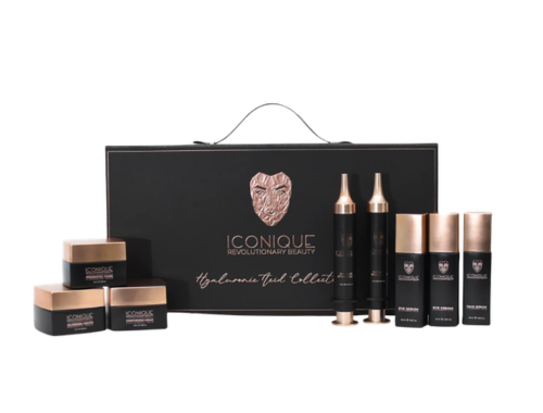 Set of skincare products from Iconiq, including three bottles and three jars, with a black gift box bearing the Iconiq logo and an emblem of a lion's head.