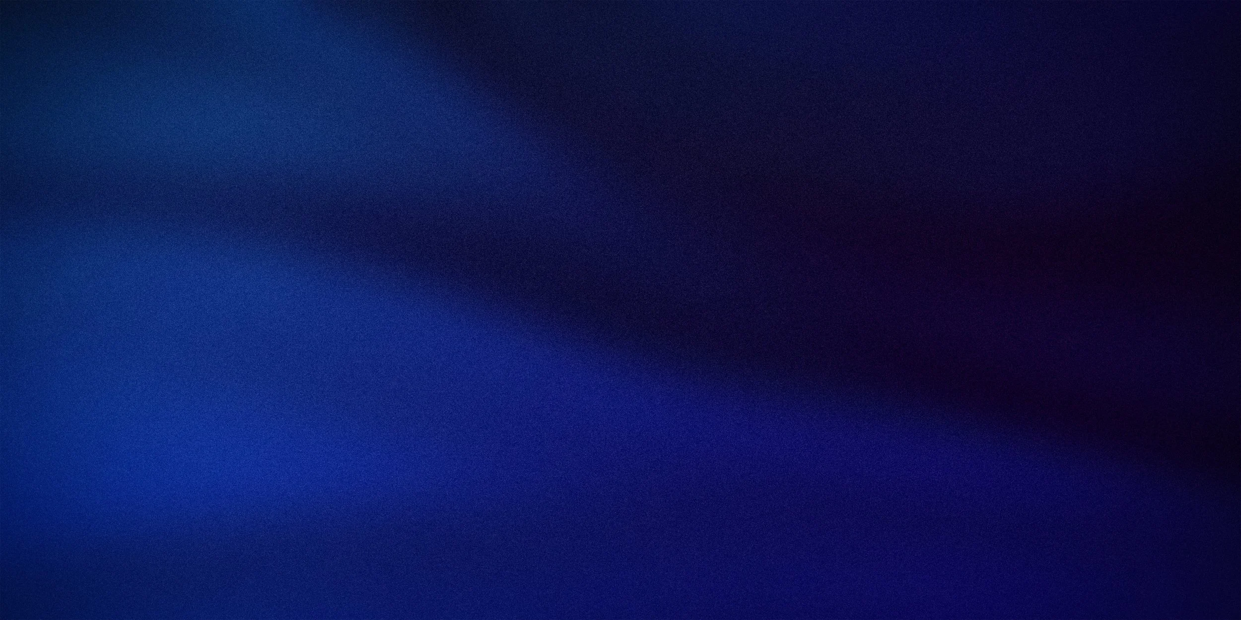 An abstract image with a gradient of dark blue and black colors.