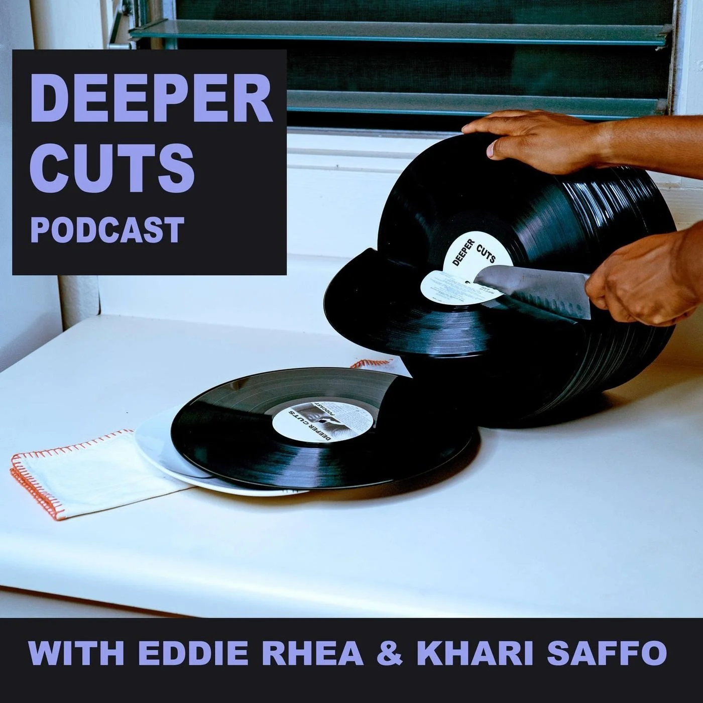 A person cuts a vinyl record with a knife. There are multiple records on the table, one on a dish. A black sign with purple text reads, 'Deeper Cuts Podcast,' at the top left corner. At the bottom of the image, purple text states, 'With Eddie Rhea & Khari Saffo.' The surface is white, and the background shows a window with horizontal blinds.