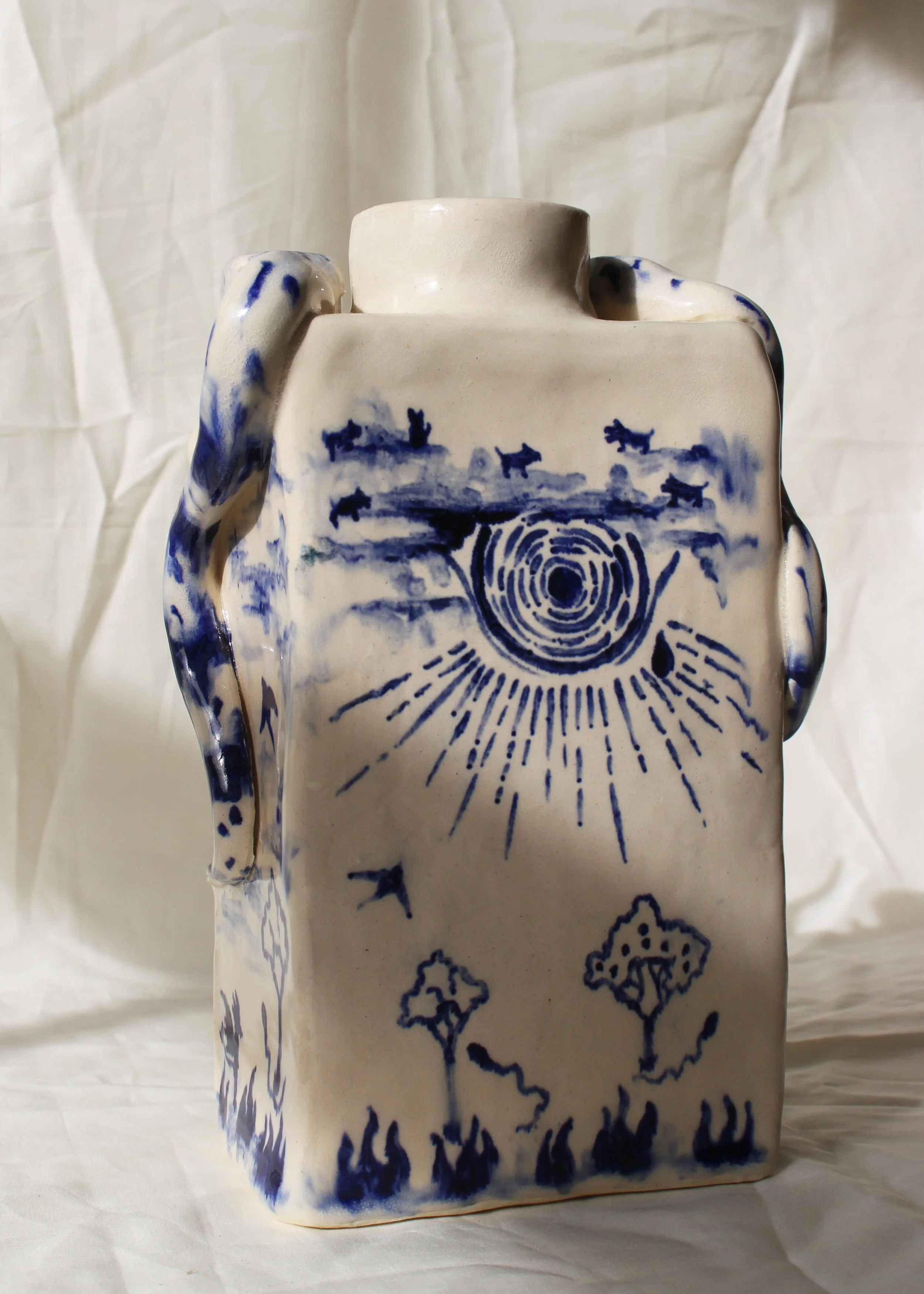 A handbuilt ceramic art piece and vase painted with blue colbalt oxide designed by Anna Fox Ceramics