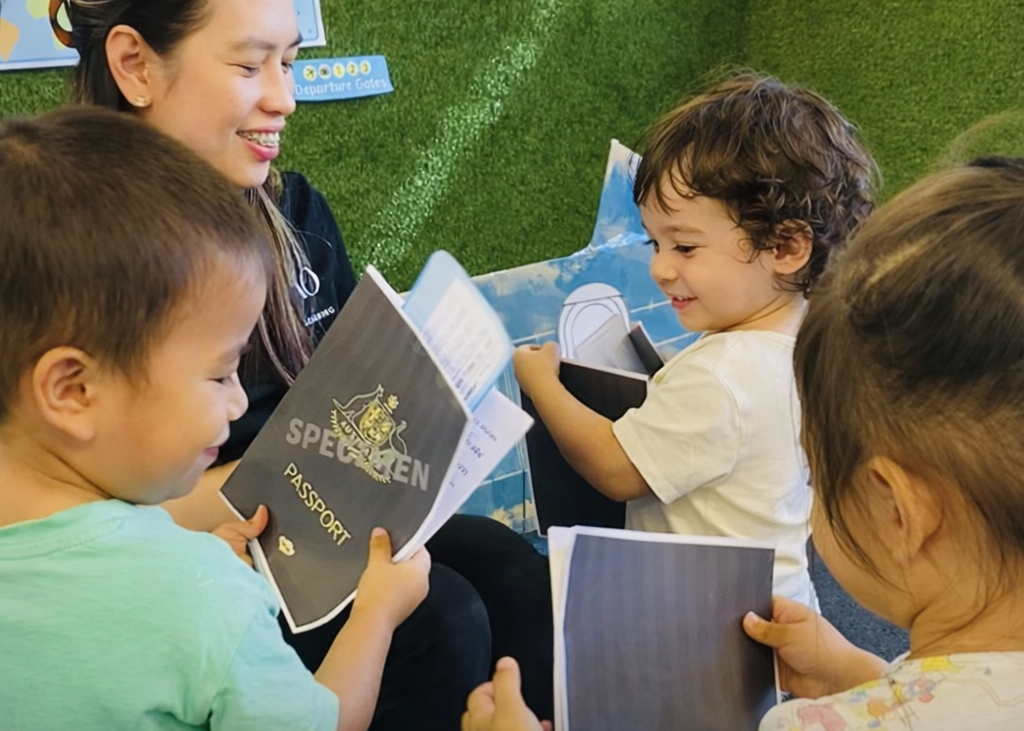 Older preschool children enjoying story time with an educator in the Kelvin Kindergarten school readiness program