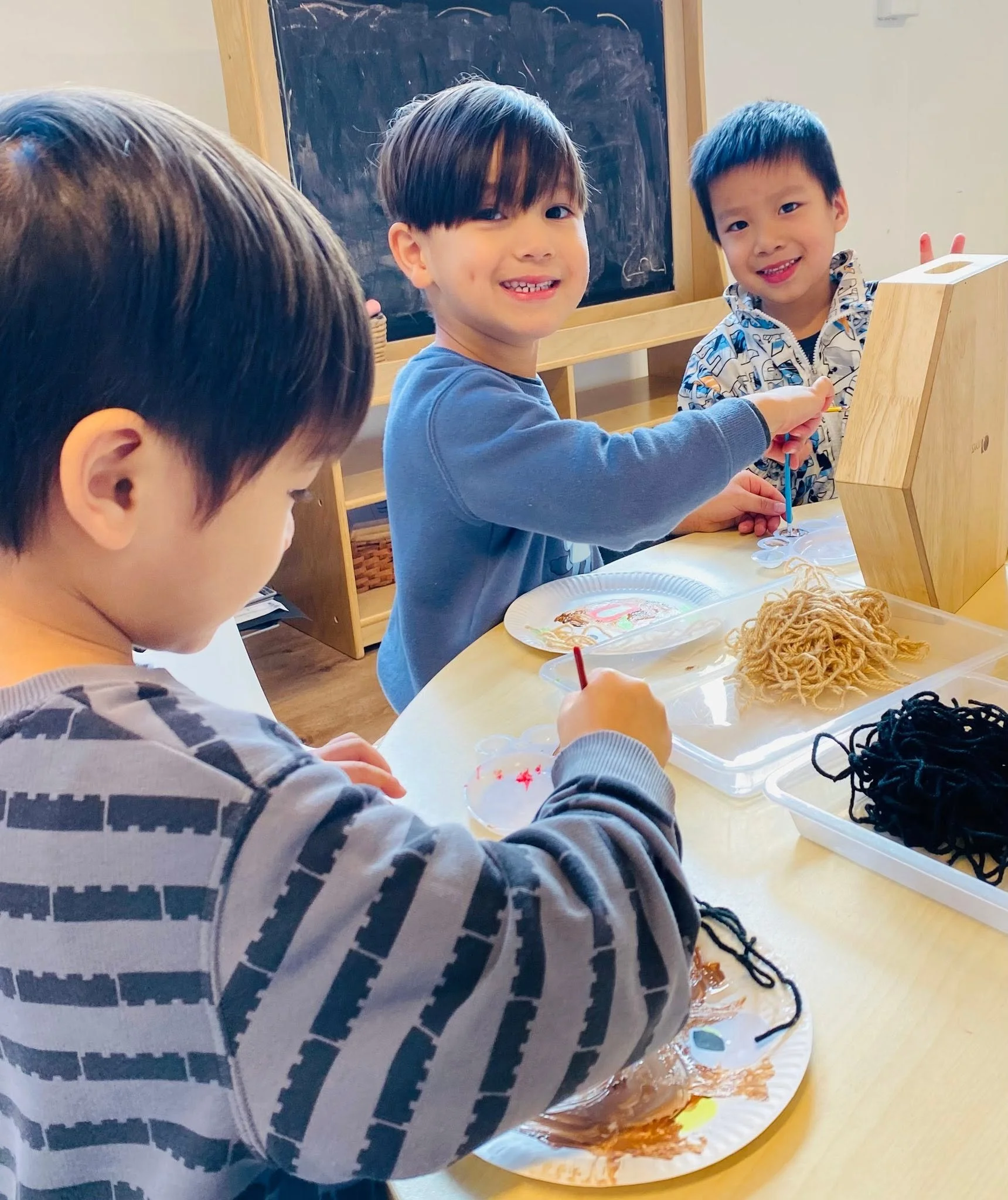 Children enjoying a creative art activity at Kelvin Kindergarten in St Ives