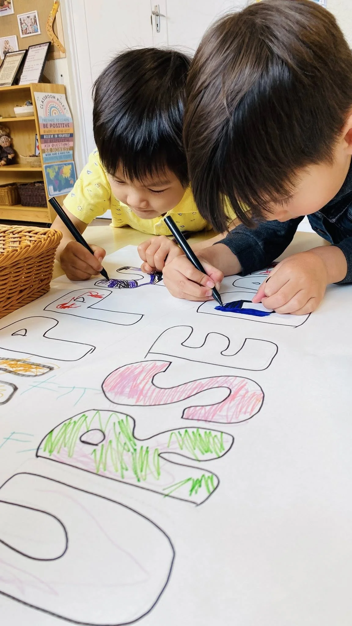 Children drawing together during a learning experience at Kelvin Kindergarten