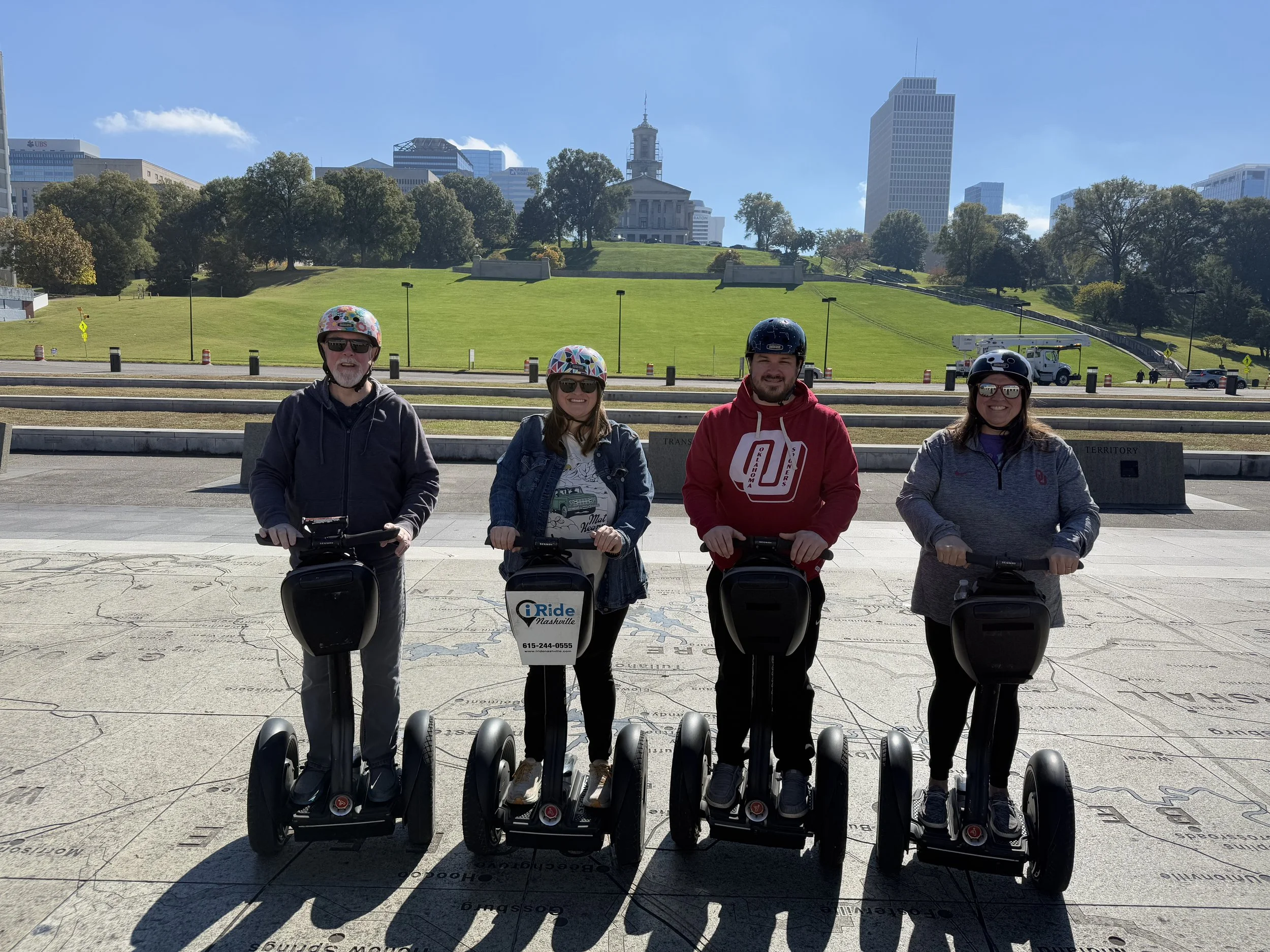 Four family members on Segways during a city tour in Tennessee.