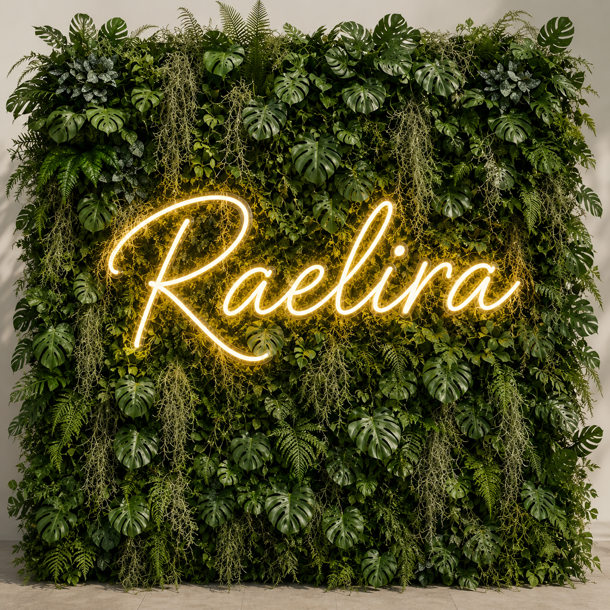 A decorative wall covered with green tropical leaves and plants.