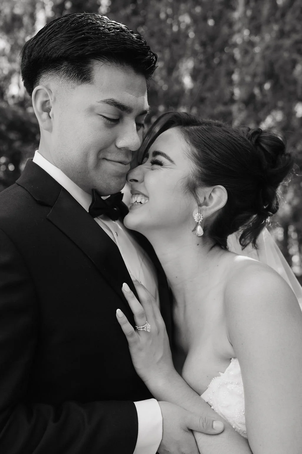 Bride looking up at the groom during an elegant outdoor wedding portrait in Las Vegas.