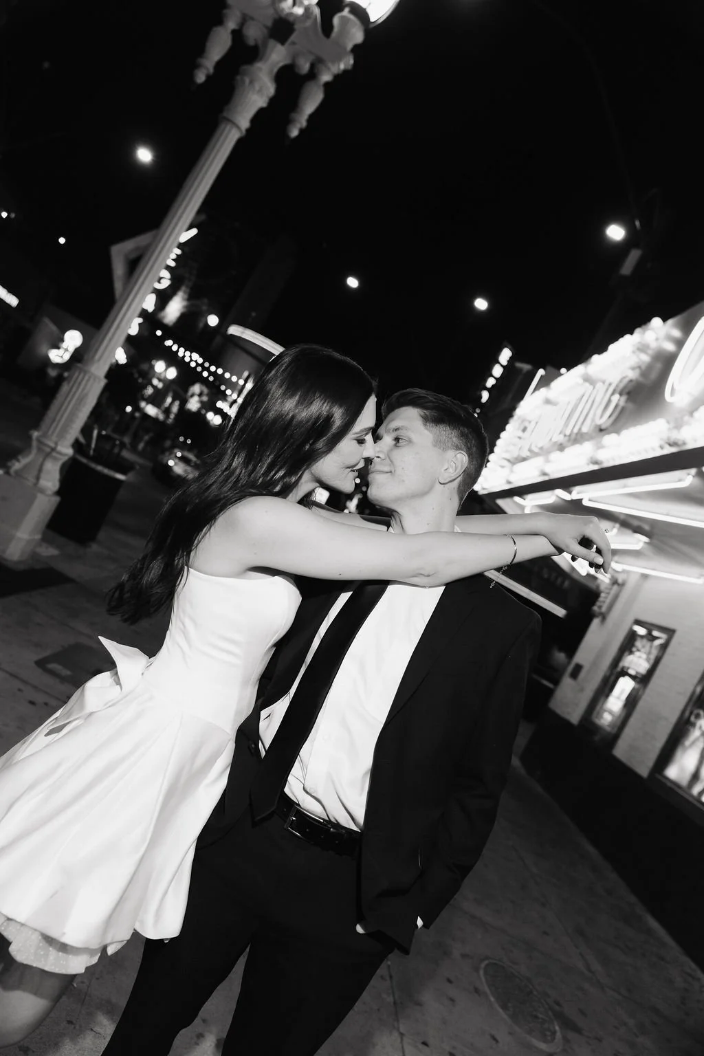 Bride and groom get close on the Vegas strip after an elopement