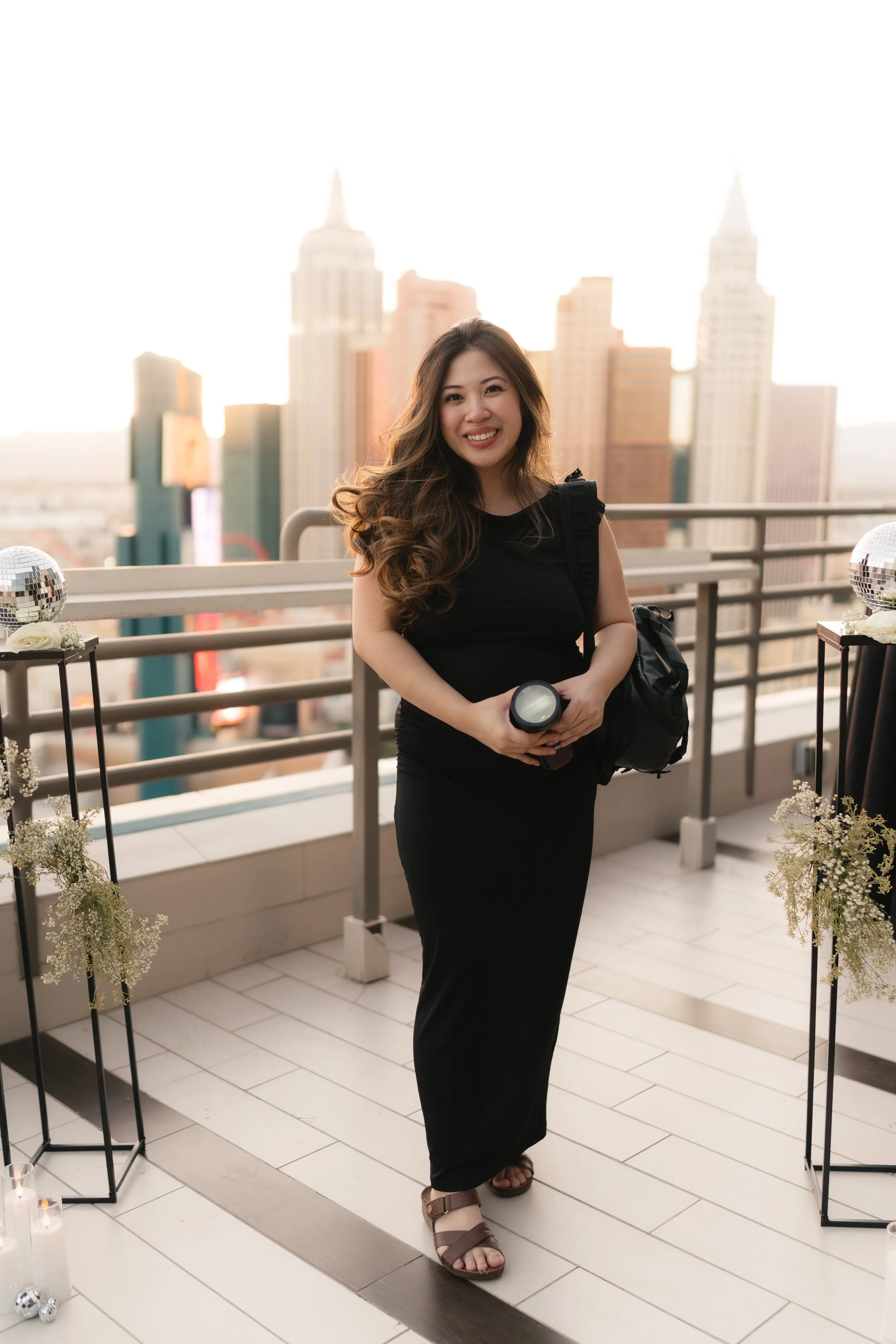 Las Vegas wedding photographer standing on a Vegas rooftop with her camera