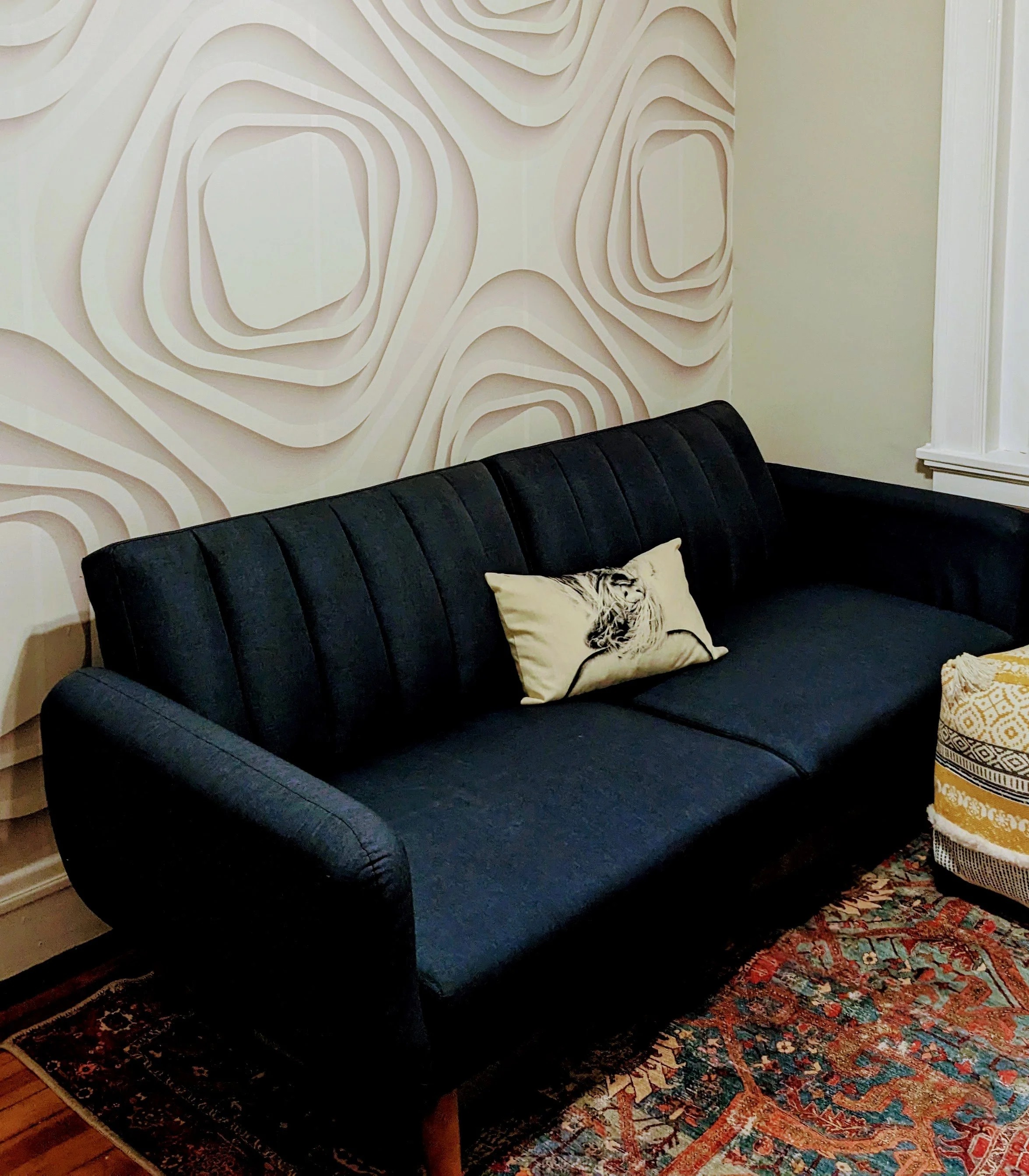 After: A textured statement wallpaper brings warmth and personality to the space