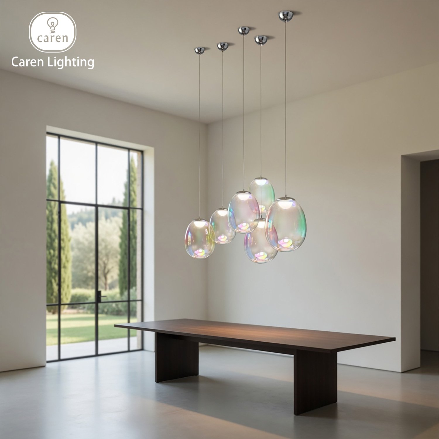 Modern interior with a wooden dining table, ten iridescent glass pendant lights hanging from the ceiling, and large windows showing trees outside.