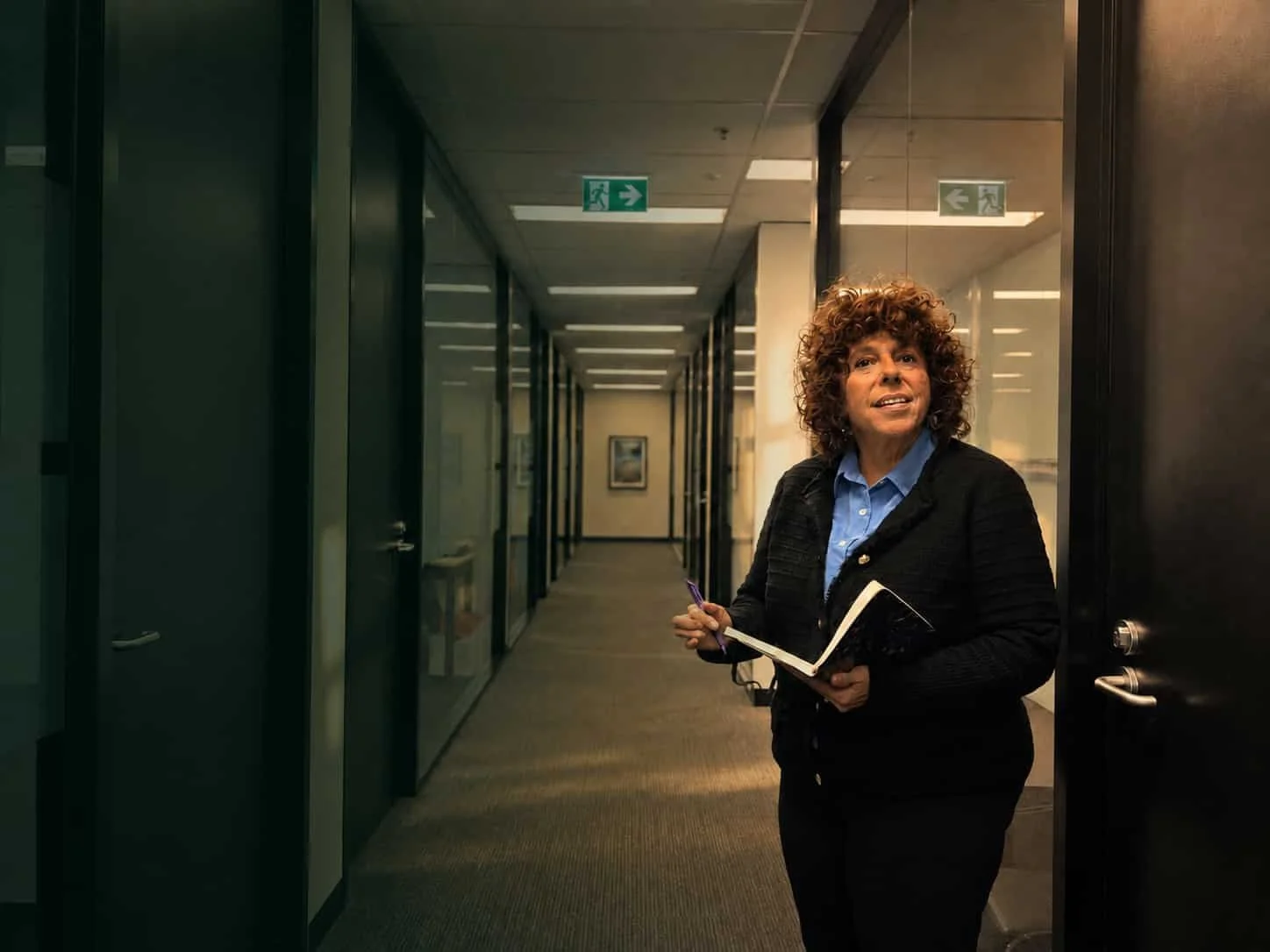 Psychologist Jasmine Sliger standing in a corridor at her Sydney office.