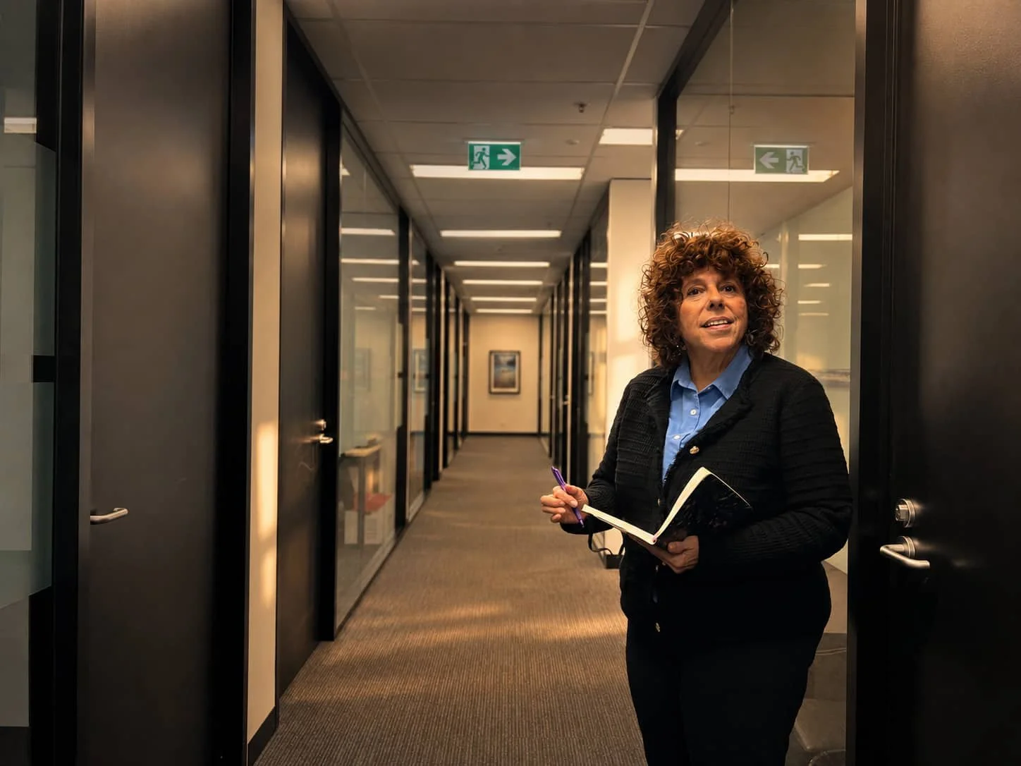 Psychologist Jasmine Sliger standing in the corridor of her Sydney office.