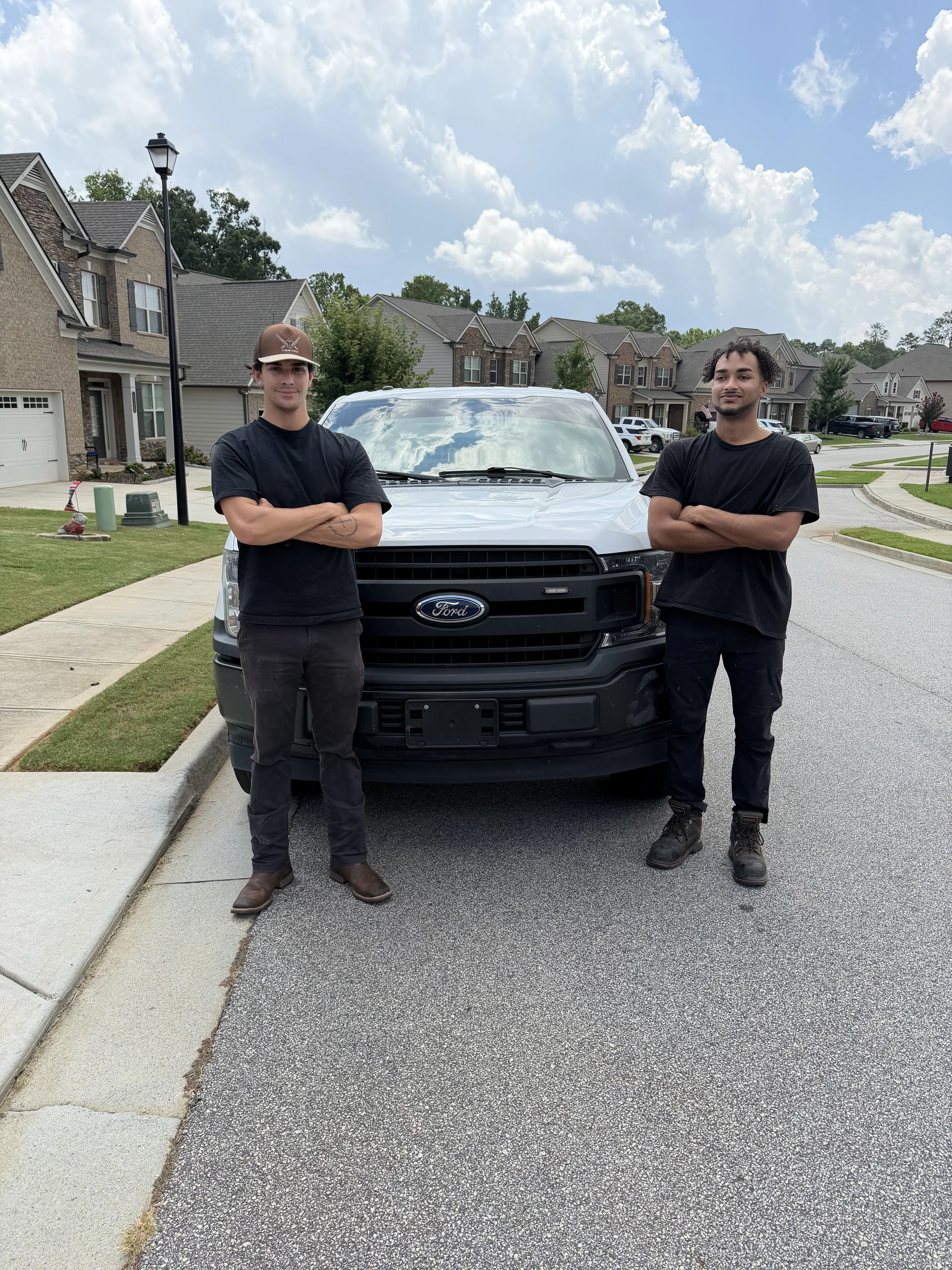 Chandler and Dillon Payne, the brothers who own No Pain Junk Removal, with their truck in Hall County, GA