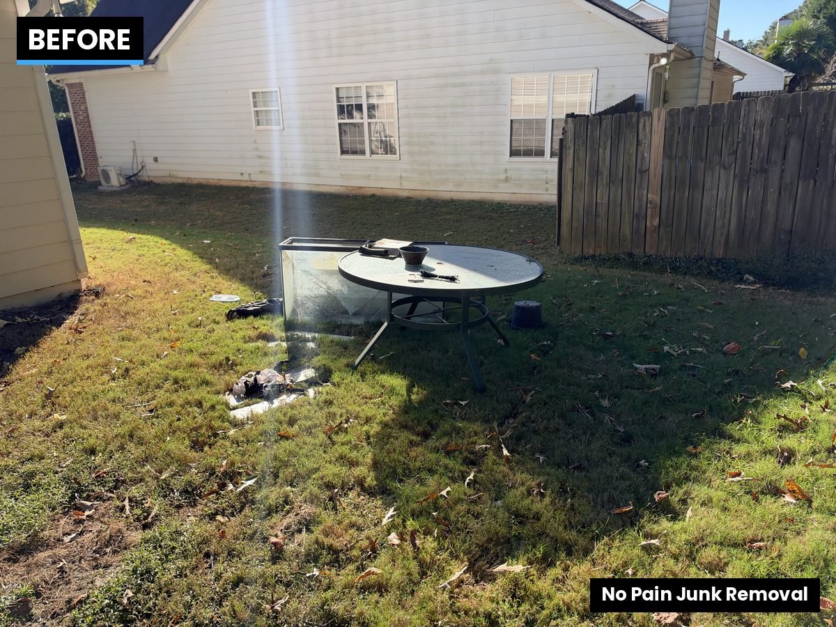 Glass patio table and old aquarium before removal in Lawrenceville, GA