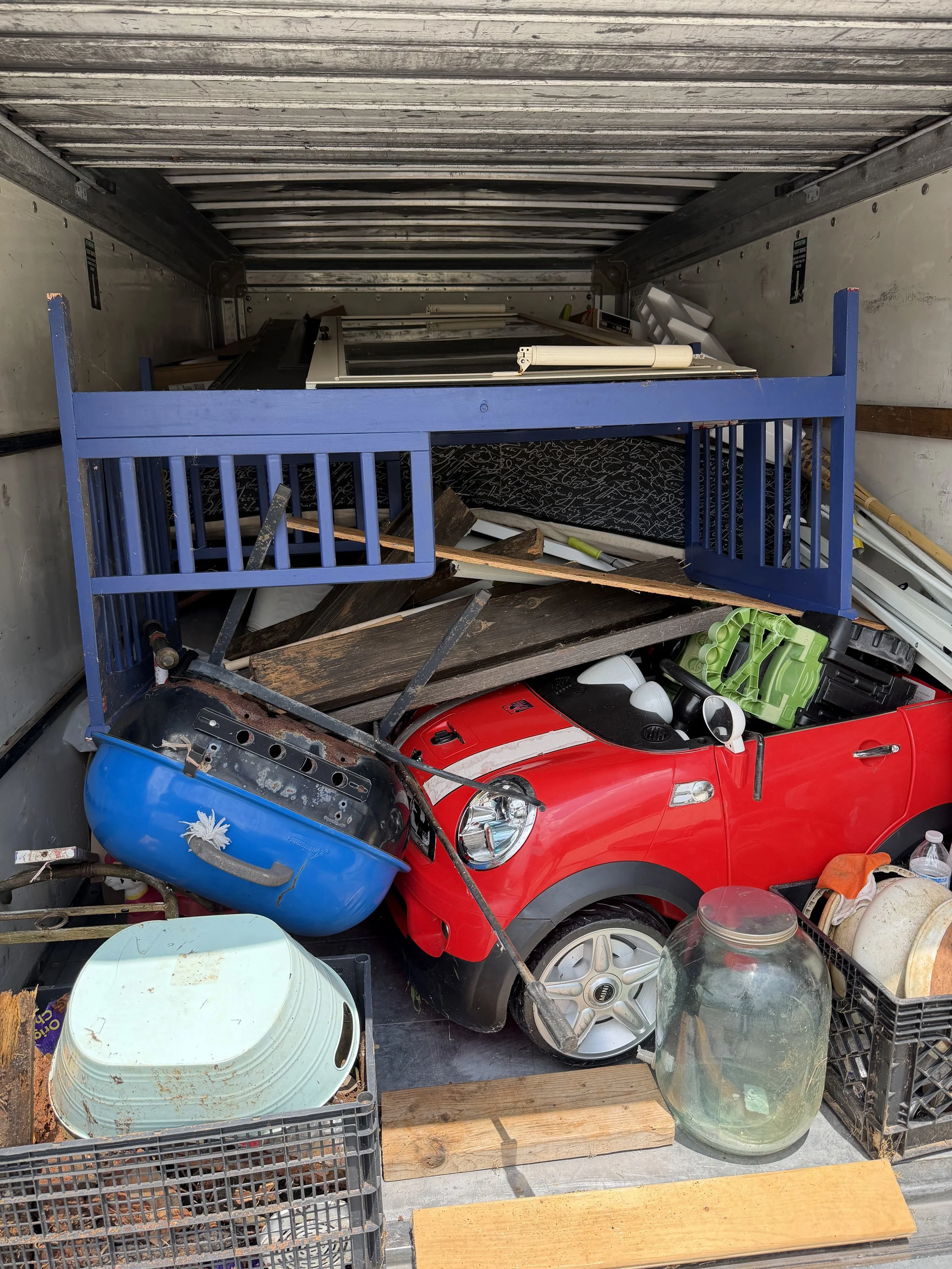 Trailer loaded with a crib, furniture and household items from a furniture removal job in Hall County, GA
