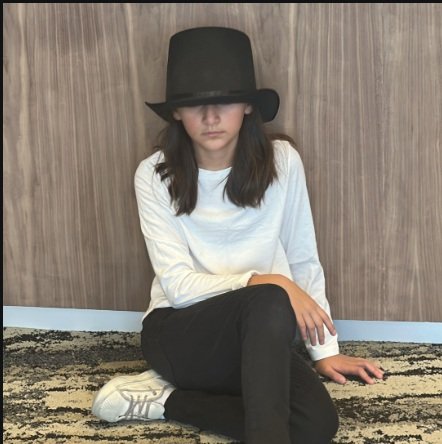 Bird Sitting with hat.jpg