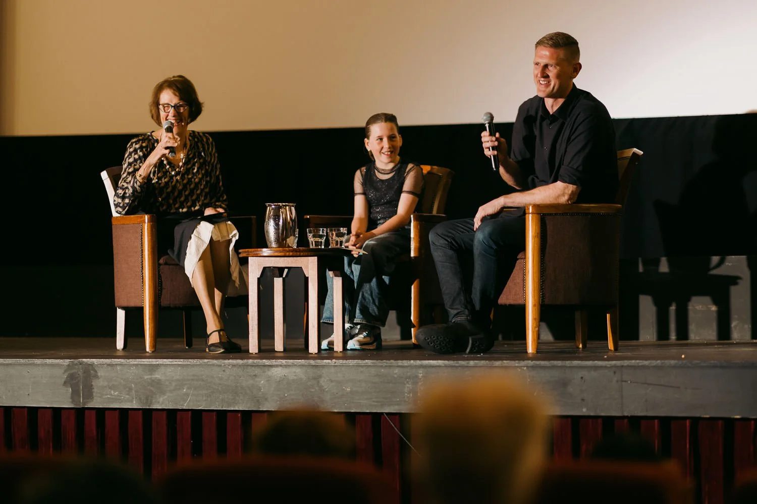 Q&A following a screening of Things Will Be Different, with filmmaker Jerome Cole, the young lead actress and the Q&A host seated on stage in conversation.