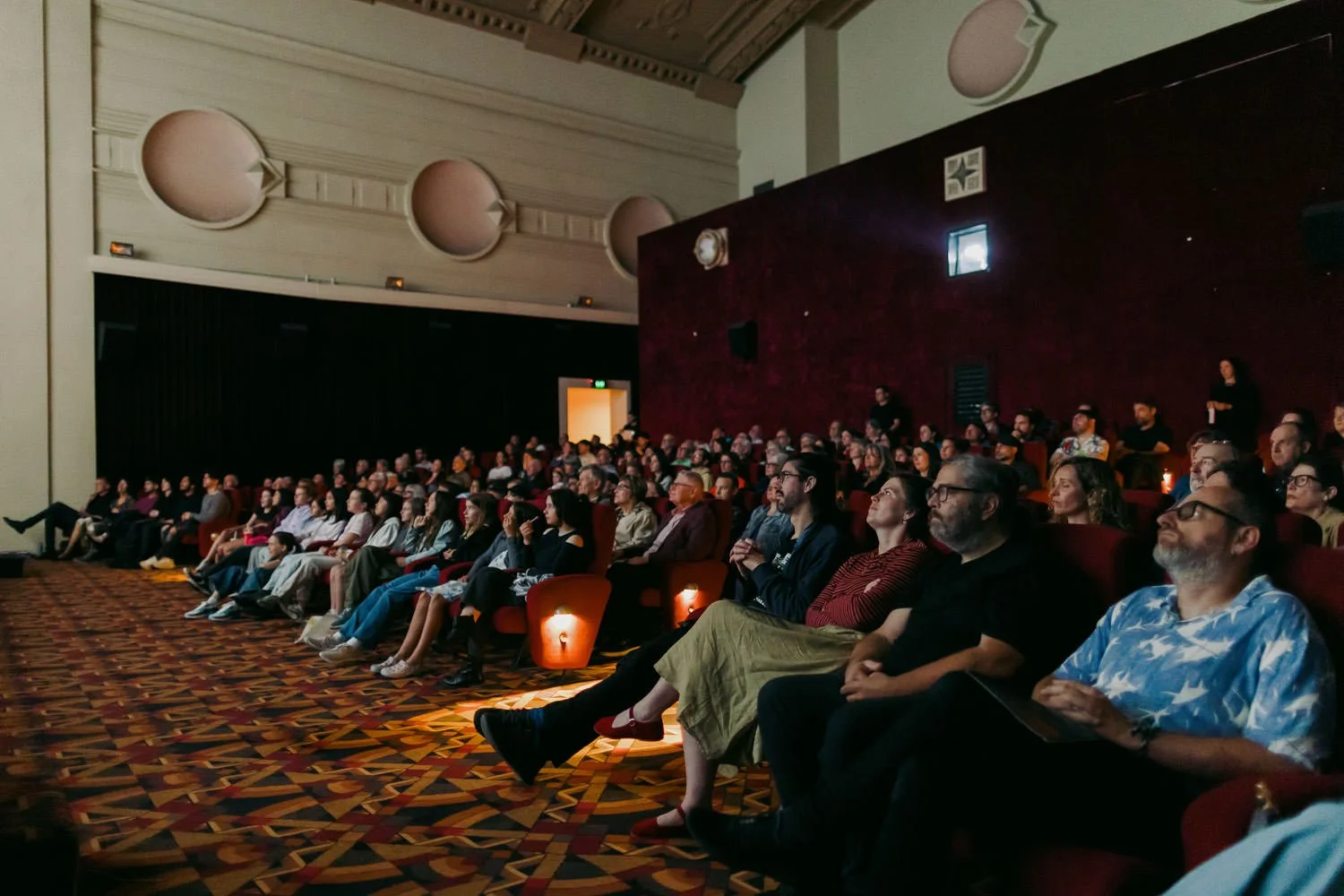 Audience at the Palace Cinemas screening of Things Will Be Different, seated in the auditorium watching the film.