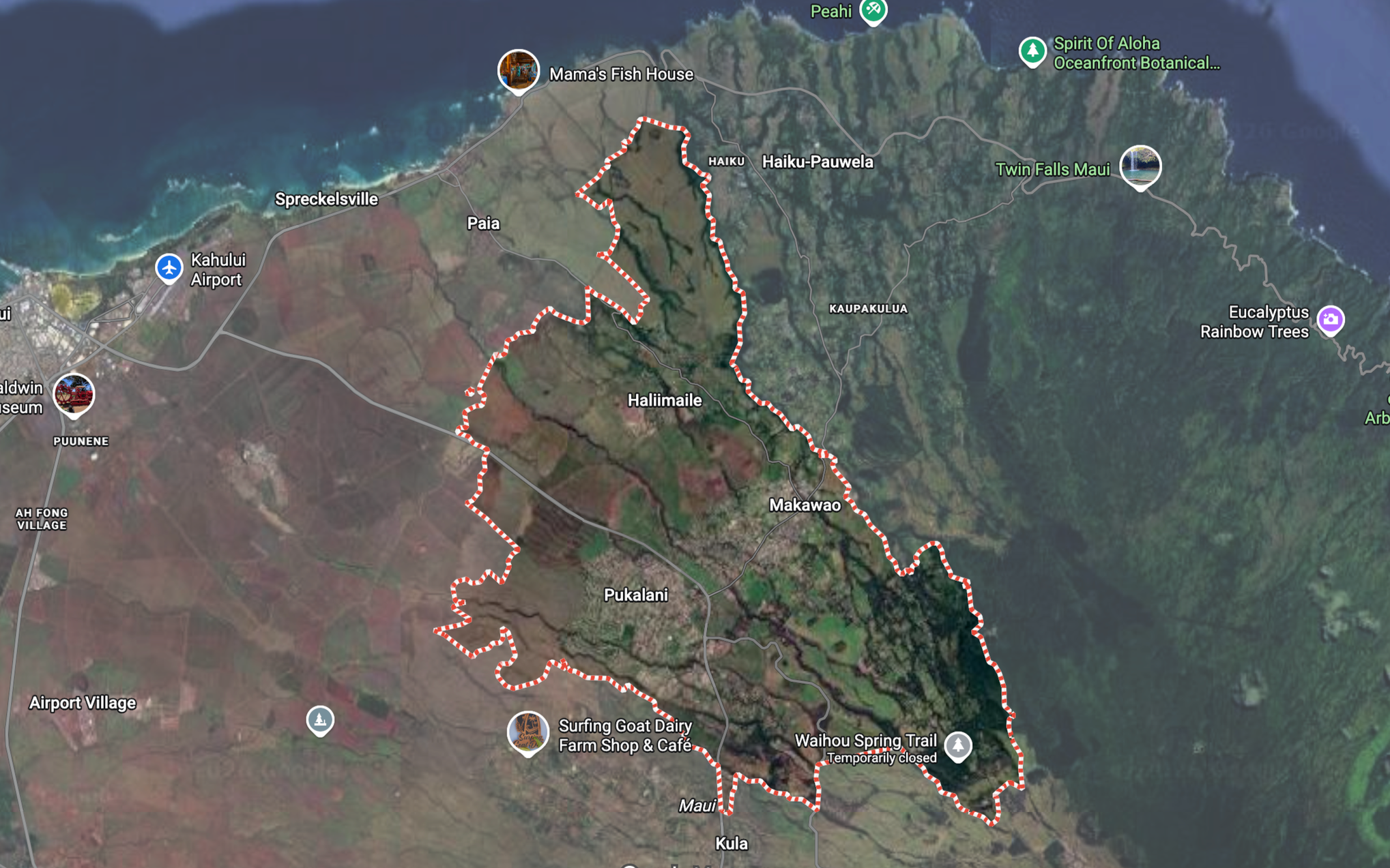 Satellite map of Maui, Hawaii, showing towns, roads, and landmarks such as Kahului Airport, Mama's Fish House, Surfing Goat Dairy, and Waihou Spring Trail. A red dotted line indicates a trail or route.