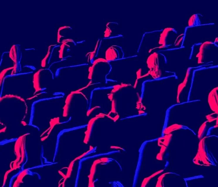 Audience members seated in an auditorium at the Las Vegas Film Festival an international cinema event from the Entertainment Capital of the World www.lasvegasfilmfestival.com ●