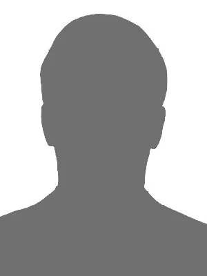 Ein silhouettenhafter menschlicher Kopf und Schultern in Grau vor hellem Hintergrund.