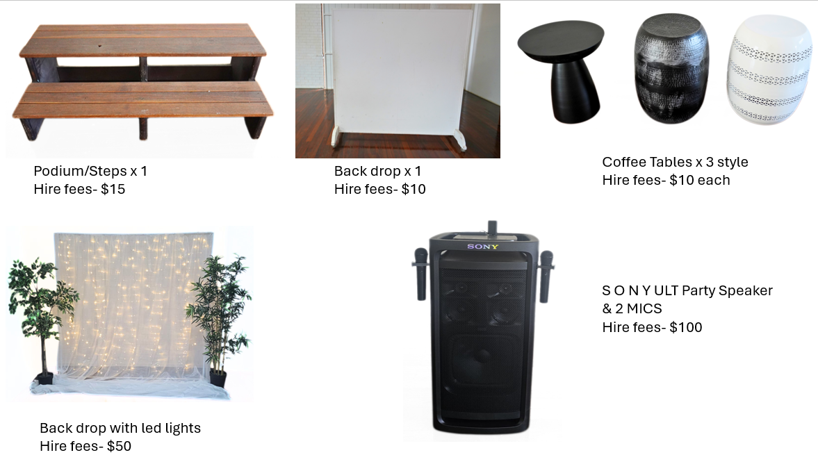 Event setup with a wooden podium, a white back drop, three coffee tables, a backdrop with LED lights, and a SONY portable speaker with two microphones.