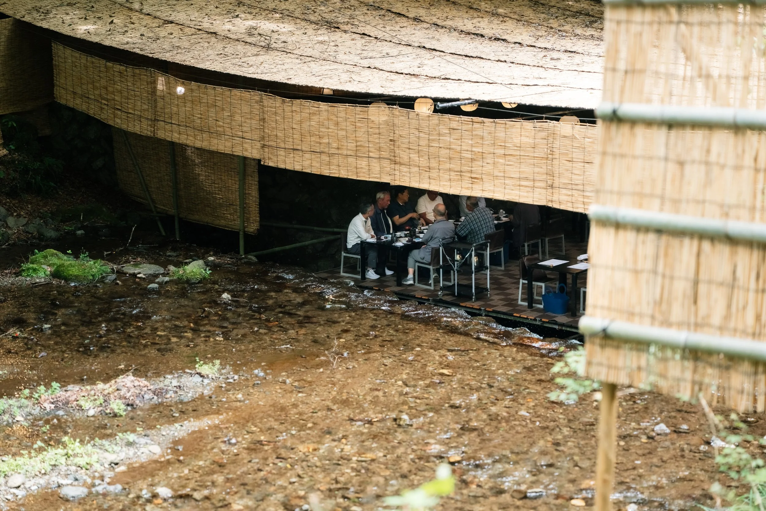 A group of people dining at kawadoko restaurant in Kibune, Kyoto - editorial photography in Kyoto, Japan.