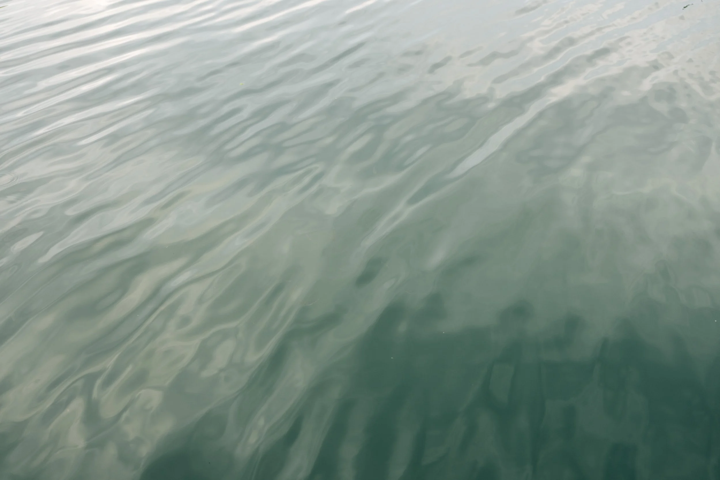 Calm water with gentle ripples on the surface in Tsukumo bay, Noto, Ishikawa, editorial travel photography, Japan.