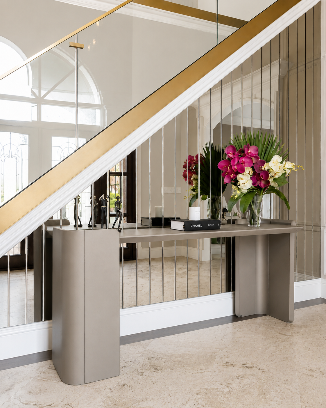 Contemporary staircase design with glass railing, custom millwork, modern decor and elegant architectural details.