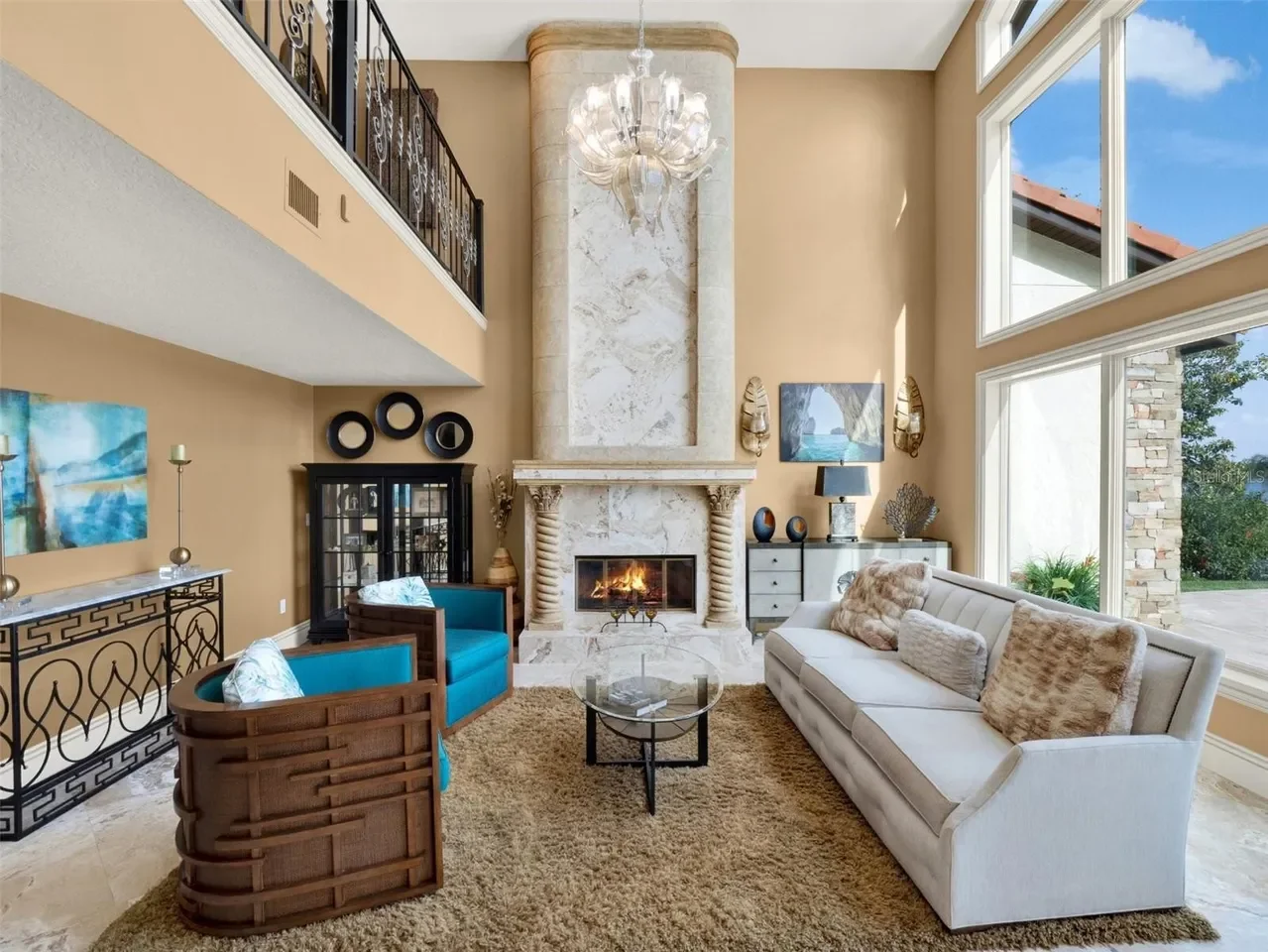 Living room before renovation, showing the original fireplace, furniture and layout prior to the Studio Bortto interior design transformation.