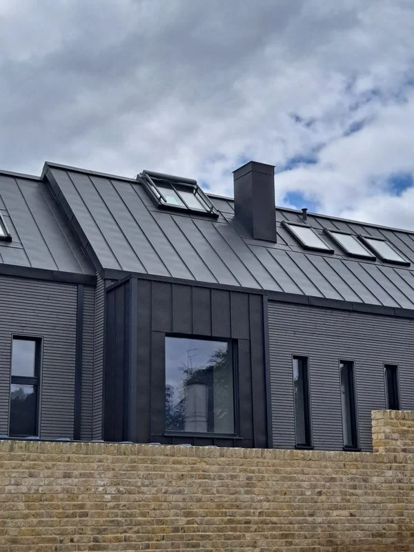 VMZINC Anthra (standing seam) roof and façade cladding.