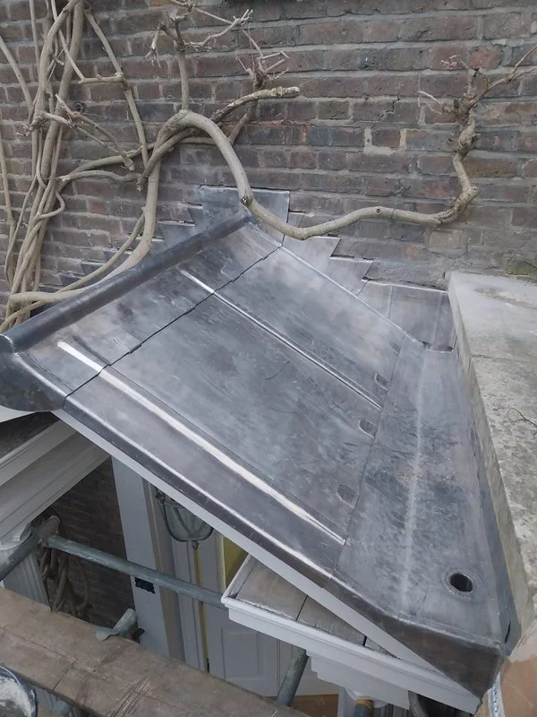 VMZINC Natural Bright (traditional bay roof detailing). 