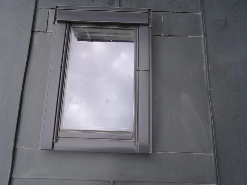 Close-up of a gray velux window fitting.