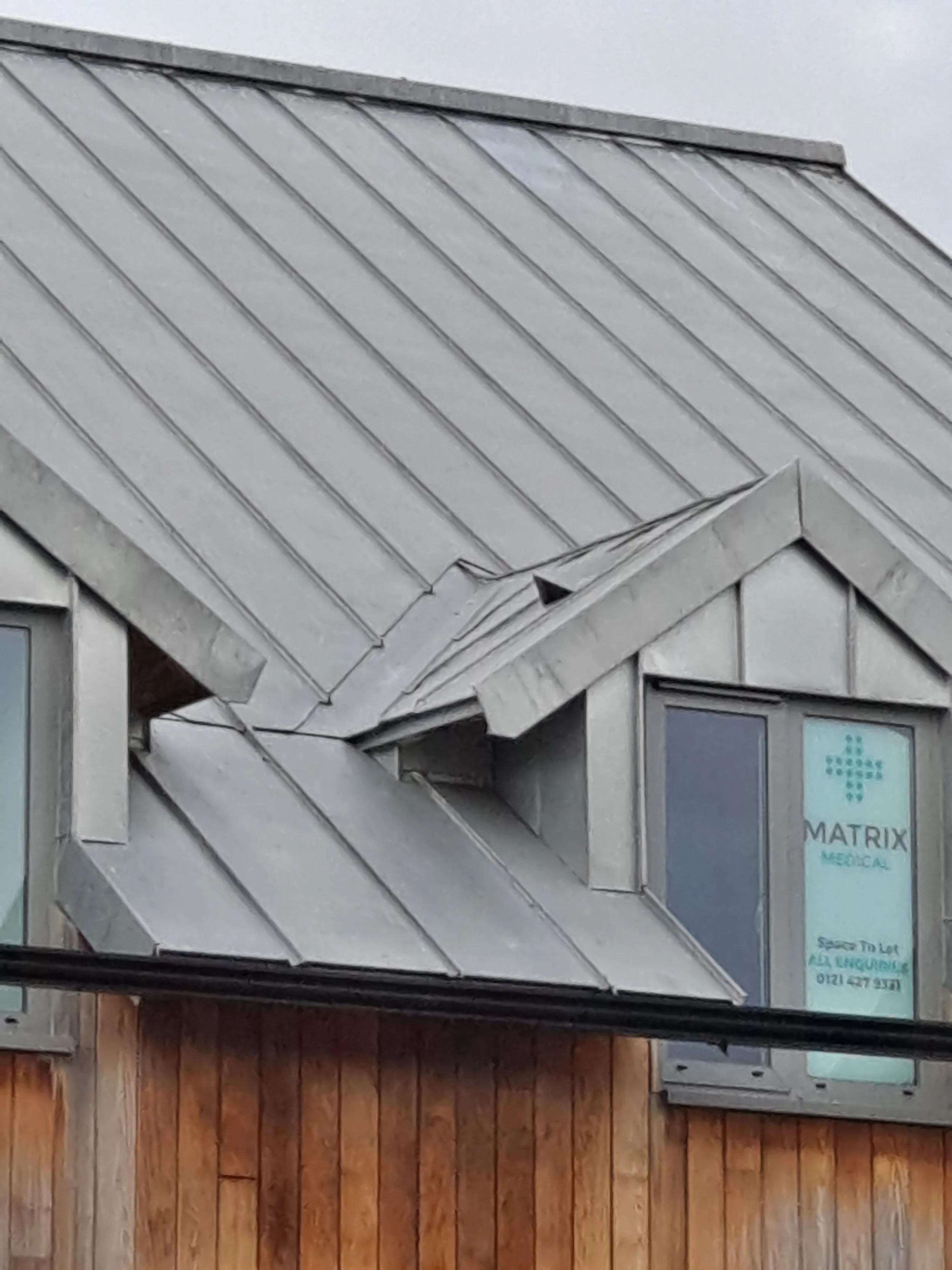 Zinc sloped roof and a window.