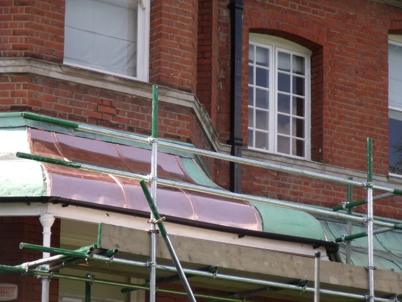 Copper canopy repair (traditional sheet copper work). 